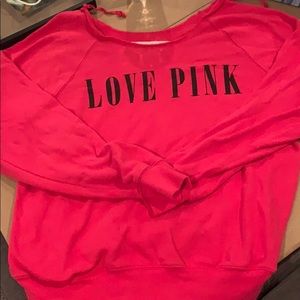 pink VS sweater. Off shoulder cut neck.